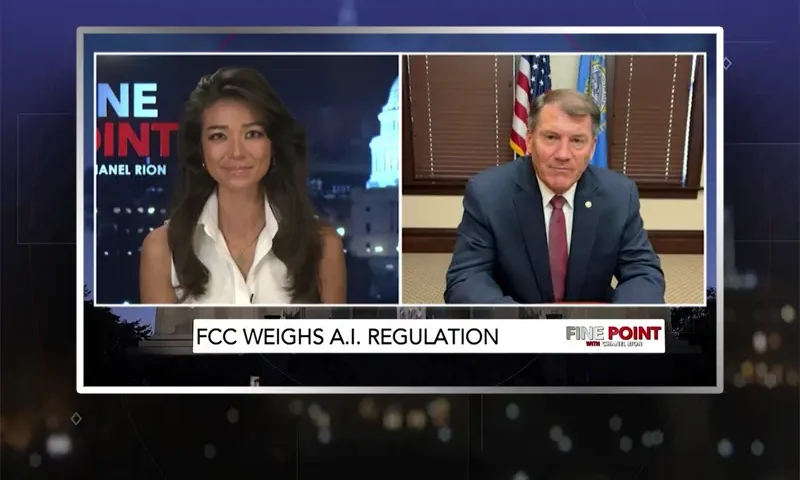 Video still from Fine Point on One America News Network showing a split screen of the host on the left side, and on the right side is the guest, Mike Rounds.