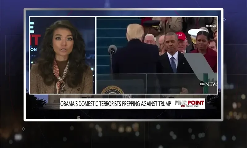 Video still of the host of Fine Point at the desk of their talk show on One America News Network.