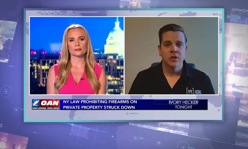 Video still from Ivory Hecker Tonight on One America News Network showing a split screen of the host on the left side, and on the right side is the guest, Cody Wisniewski.
