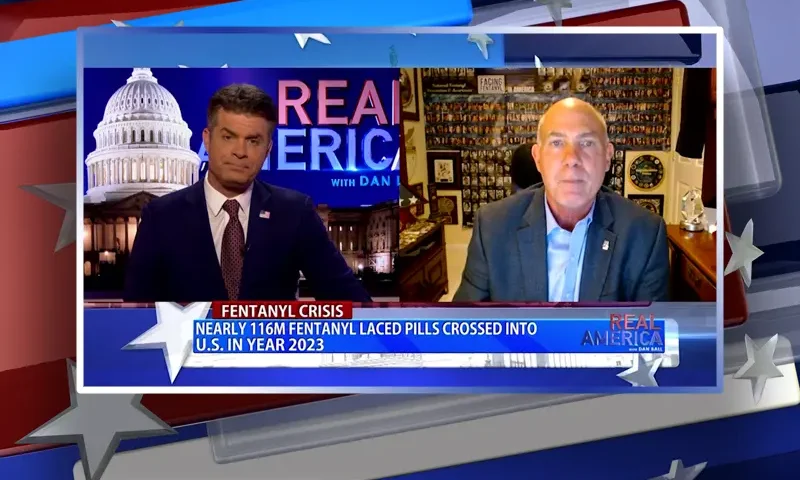 Video still from Real America on One America News Network showing a split screen of the host on the left side, and on the right side is the guest, Derek Maltz.
