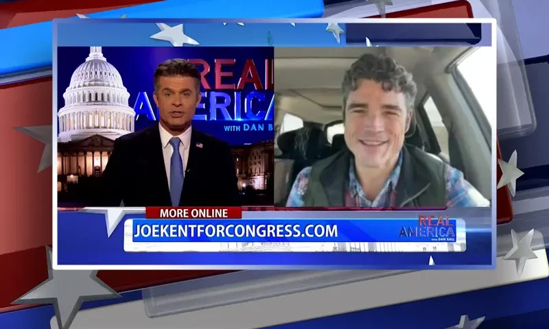 Video still from Real America on One America News Network showing a split screen of the host on the left side, and on the right side is the guest, Joe Kent.