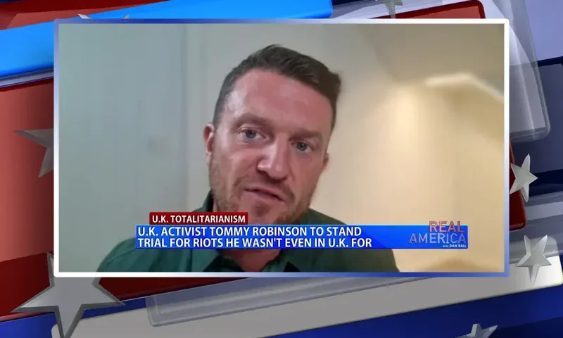 Video still from Real America on One America News Network during an interview with the guest, Tommy Robinson.