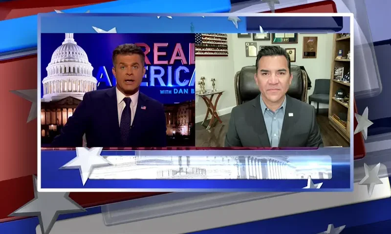 Video still from Real America on One America News Network showing a split screen of the host on the left side, and on the right side is the guest, Victor Avila.