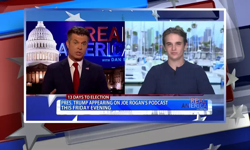 Video still from Real America on One America News Network showing a split screen of the host on the left side, and on the right side is the guest, Bo Loudon.