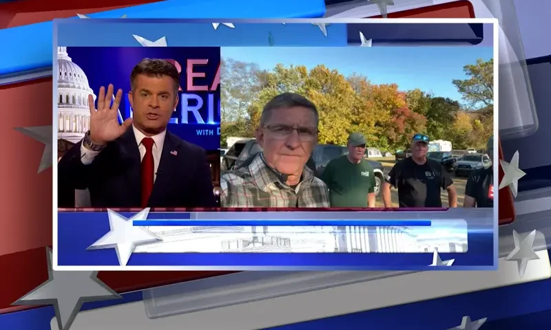 Video still from Real America on One America News Network showing a split screen of the host on the left side, and on the right side is the guest, Gen. Michael Flynn.