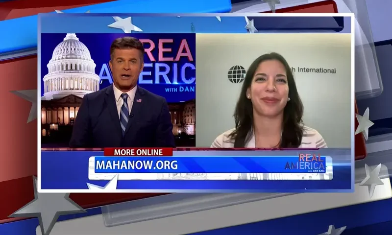 Video still from Real America on One America News Network showing a split screen of the host on the left side, and on the right side is the guest, Gaby Berrospi.