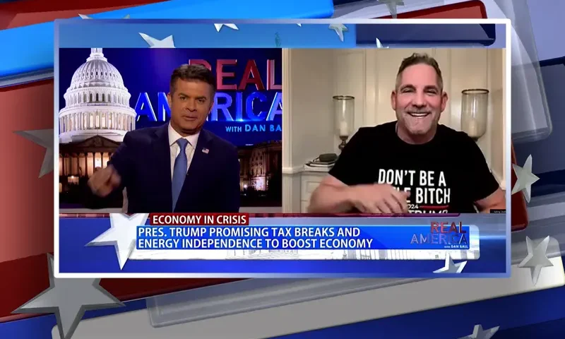 Video still from Real America on One America News Network showing a split screen of the host on the left side, and on the right side is the guest, Grant Cardone.
