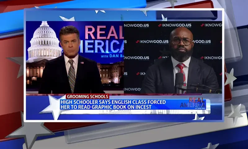 Video still from Real America on One America News Network showing a split screen of the host on the left side, and on the right side is the guest, John Amanchukwu.