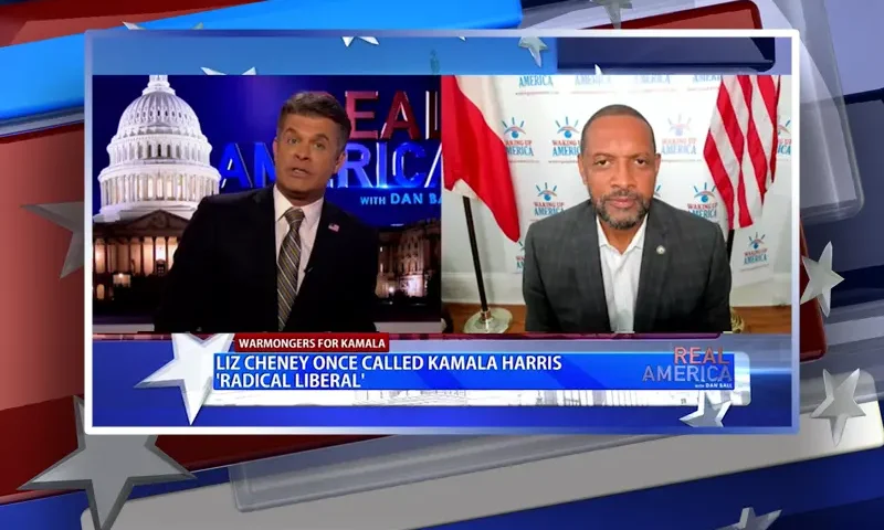 Video still from Real America on One America News Network showing a split screen of the host on the left side, and on the right side is the guest, Vernon Jones.