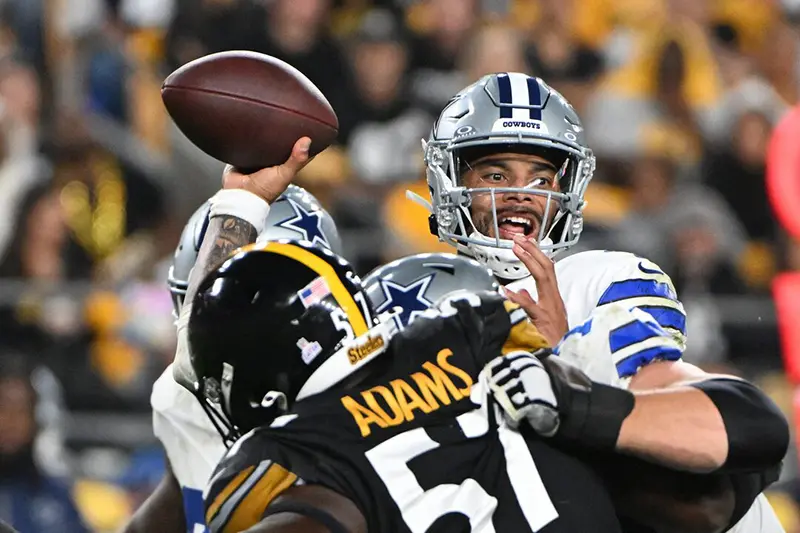 Dallas Cowboys quarterback Dak Prescott (4) l throws a pass while being pressured by Pittsburgh Steelers defensive tackle Montravius Adams (57) during the second quarter at Acrisure Stadium. Mandatory Credit: Barry Reeger-Imagn Images