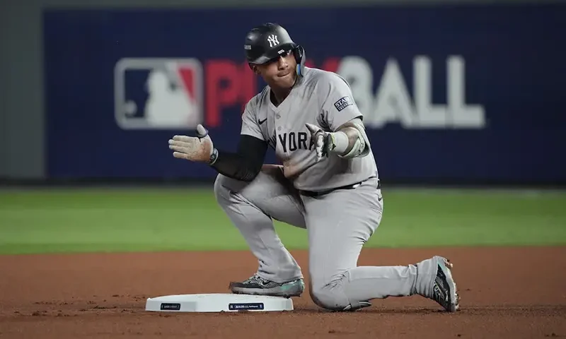 New York Yankees second baseman Gleyber Torres (25) celebrates after a double during the first inning against the Kansas City Royals during game four of the ALDS for the 2024 MLB Playoffs at Kauffman Stadium. Mandatory Credit: Denny Medley-Imagn Images