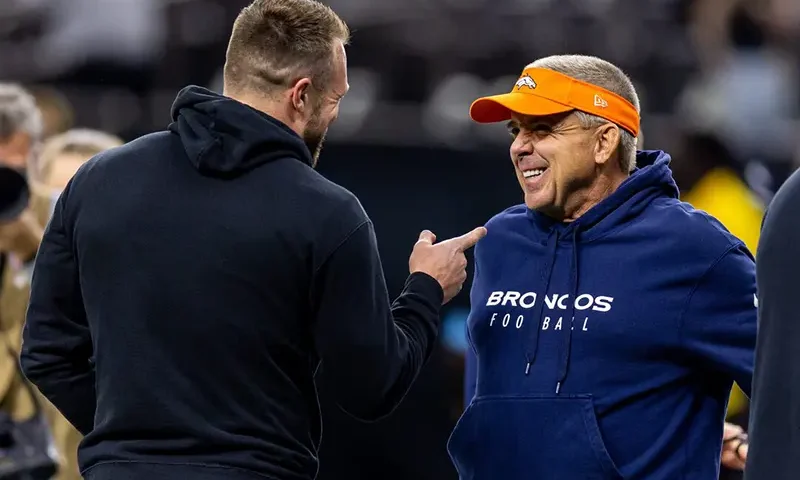 Denver Broncos head coach Sean Payton talks with New Orleans Saints tight end Taysom Hill (7) during the warmups before the game against the Denver Broncos at Caesars Superdome. Mandatory Credit: Stephen Lew-Imagn Images