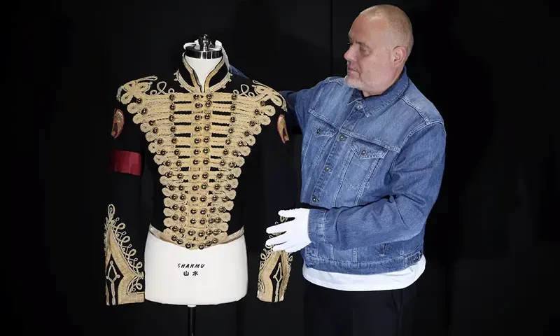 Director of music Mark Hochman poses with Michael Jackson's Tour Rehearsal "Thriller" Jacket, at Propstore in Chenies, Britain, September 30, 2024. REUTERS/Mina Kim/File Photo