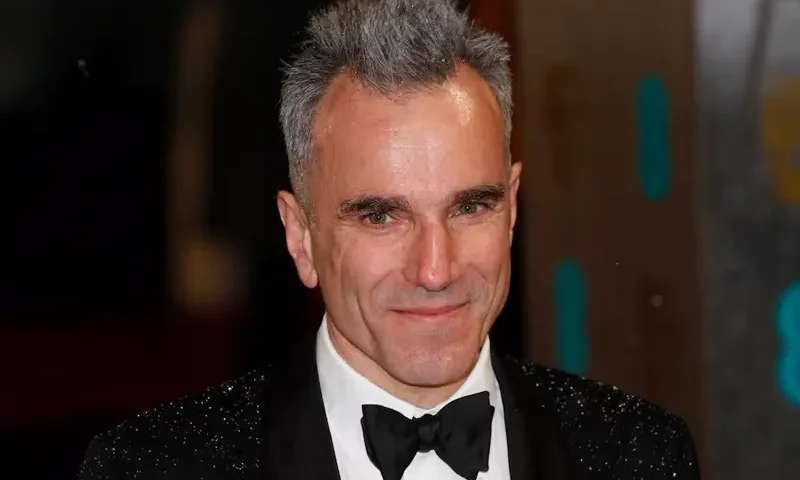 Actor Daniel Day-Lewis poses as he arrives for the British Academy of Film and Arts (BAFTA) awards ceremony at the Royal Opera House in London February 10, 2013. REUTERS/Suzanne Plunkett/File Photo