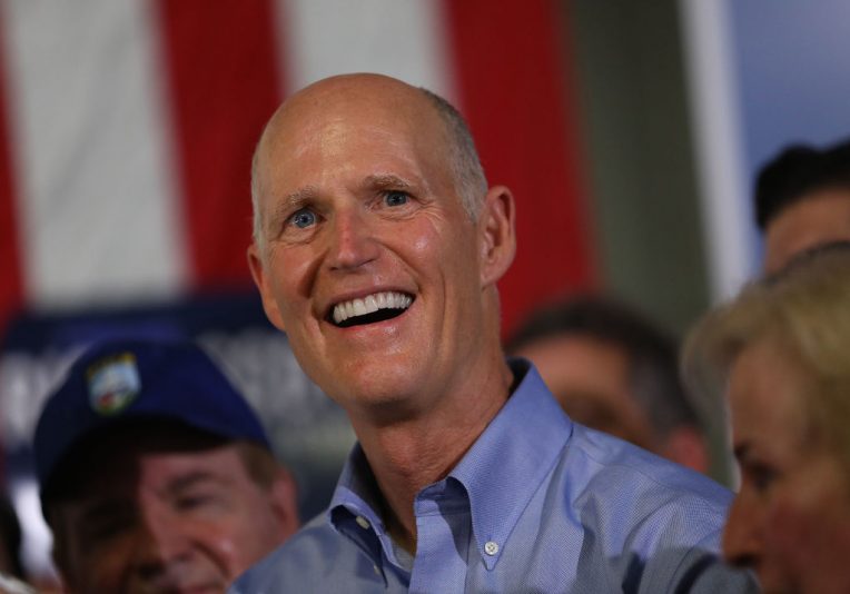 HIALEAH, FLORIDA - NOVEMBER 05: Florida governor and Republican senatorial candidate Rick Scott addresses the crowd as he attends a Get out the Vote Rally at AmeriKooler on November 05, 2018 in Hialeah, Florida. Governor Scott is facing off against Sen. Bill Nelson (D-FL) on election day. (Photo by Joe Raedle/Getty Images)