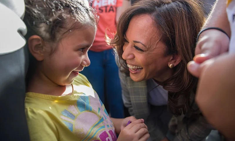 HOMESTEAD, FLORIDA - JUNE 28: Democratic presidential candidate, Sen. Kamala Harris (D-CA) speaks with Roxanna Gozzer, whose mother is originally from El Salvador and is in the U.S. under Temporary Protected Status, as she visits the outside of a detention center for migrant children on June 28, 2019 in Homestead, Florida. Democratic presidential candidates visited the detention center, which is the nation's largest center for detaining immigrant children, as the candidates spend time in the Miami area after participating in a nationally televised debate. (Photo by Joe Raedle/Getty Images)