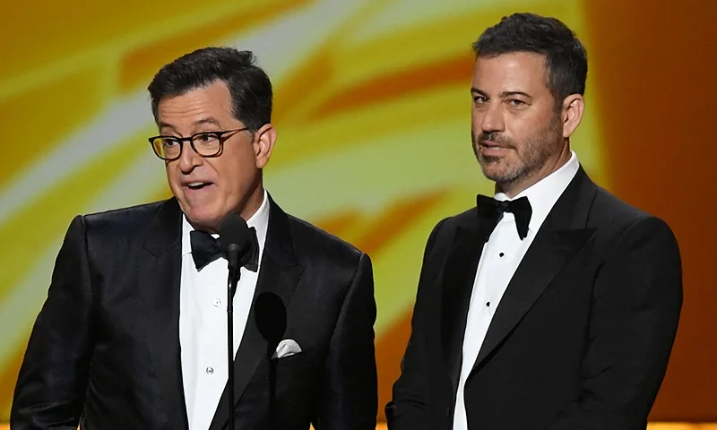 LOS ANGELES, CALIFORNIA - SEPTEMBER 22: (L-R) Stephen Colbert and Jimmy Kimmel speak onstage during the 71st Emmy Awards at Microsoft Theater on September 22, 2019 in Los Angeles, California. (Photo by Kevin Winter/Getty Images)