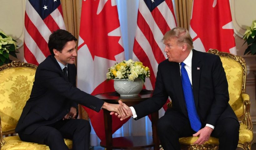US President Donald Trump (R) shakes hands with Canada's Prime Minister Justin Trudeau during a meeting at Winfield House, London on December 3, 2019. - NATO leaders gather Tuesday for a summit to mark the alliance's 70th anniversary but with leaders feuding and name-calling over money and strategy, the mood is far from festive. (Photo by Nicholas Kamm / AFP) (Photo by NICHOLAS KAMM/AFP via Getty Images)