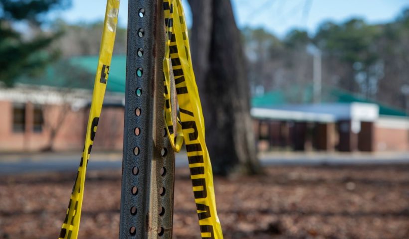 NEWPORT NEWS, VA - JANUARY 07: Police tape hangs from a sign post outside Richneck Elementary School following a shooting on January 7, 2023 in Newport News, Virginia. A 6-year-old student was taken into custody after reportedly shooting a teacher during an altercation in a classroom at Richneck Elementary School on Friday. The teacher, a woman in her 30s, suffered “life-threatening” injuries and remains in critical condition, according to police reports. (Photo by Jay Paul/Getty Images)