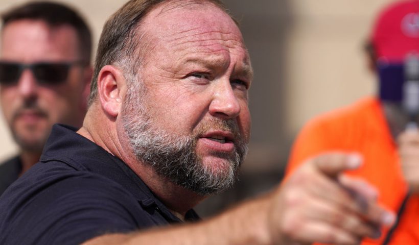 WATERBURY, CONNECTICUT - SEPTEMBER 21: InfoWars founder Alex Jones speaks to the media outside Waterbury Superior Court during his trial on September 21, 2022 in Waterbury, Connecticut. Jones is being sued by several victims' families for causing emotional and psychological harm after they lost their children in the Sandy Hook massacre. A Texas jury last month ordered Jones to pay $49.3 million to the parents of 6-year-old Jesse Lewis, one of 26 students and teachers killed in the shooting in Newtown, Connecticut. (Photo by Joe Buglewicz/Getty Images)