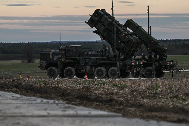 ZAMOSC, POLAND - FEBRUARY 18: Patriot launchers modules mounted on M983 HEMTT part of the US made MIM-104 Patriot surface-to-air missile (SAM) system are pictured on a open field on February 18, 2023 in Zamosc, Poland. The German armed forces deployed Patriots batteries to their NATO neighbor, after a missile explosion in Przewodow, which previous investigation suggests that came from Ukrainian air defense, killed two civilians. Since Russia's large scale military attack on Ukraine on February 24, 2022 more than 9.7 million refugees from Ukraine crossed the Polish borders to escape the conflict, with 1.4 million registering in Poland whilst others moved on to other countries. (Photo by Omar Marques/Getty Images)