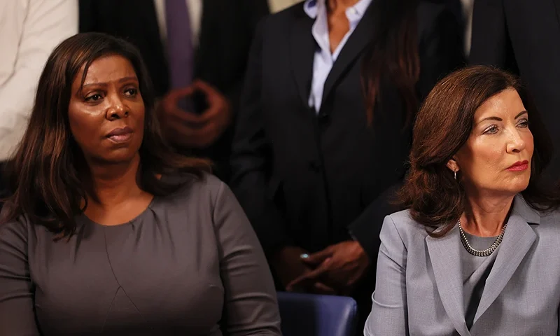 NEW YORK, NEW YORK - JULY 31: NY Attorney General Letitia James and NY Gov. Kathy Hochul listen as New York Mayor Eric Adams speaks during a press conference on gun violence prevention and public safety on July 31, 2023 in New York City. Mayor Eric Adams was joined by NY Gov. Hochul, NY Attorney General James, and members of local and state government and violence interruption groups to unveil NYC's Gun Violence Prevention Task Force blueprint for community safety. The task force's $485 million blueprint will bring people together from across 20 agencies that specialize in public safety, health care, workforce development, and education to help stop gun violence in the communities most impacted by it. (Photo by Michael M. Santiago/Getty Images)