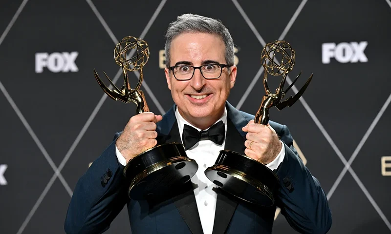 TOPSHOT - John Oliver, winner of Outstanding Scripted Variety and Outstanding Writing for a Variety Series "Last Week Tonight with John Oliver" poses in the press room during the 75th Emmy Awards at the Peacock Theatre at L.A. Live in Los Angeles on January 15, 2024. (Photo by Robyn BECK / AFP) (Photo by ROBYN BECK/AFP via Getty Images)