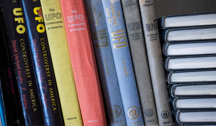 Books on UFOs are displayed at the Archives for the Unexplained (AFU) in Norrkoping, Sweden on March 12, 2024. Press clippings, books and first-hand accounts of people claiming to have travelled to Venus or the Moon: a catalogue of paranormal phenomena fills an underground library in the Swedish town of Norrkoping. The four kilometres of shelves draw historians and curious people from around the world to view what claims to be the world's biggest library of paranormal phenomena. (Photo by Jonathan NACKSTRAND / AFP) (Photo by JONATHAN NACKSTRAND/AFP via Getty Images)