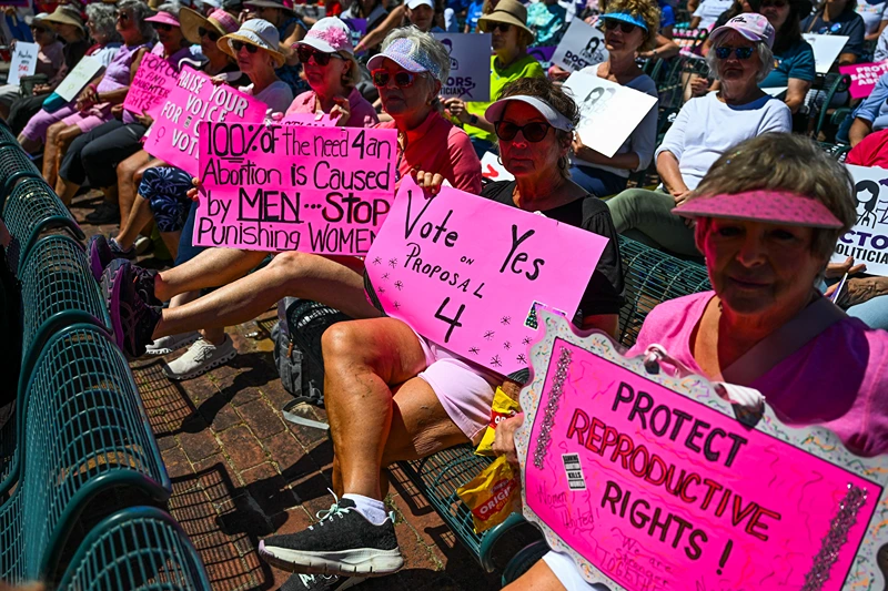Pro-abortion rights activists participate in the "Rally for Our Freedom" to protect abortion rights for Floridians, in Orlando, Florida, on April 13, 2024. Florida Rising, Floridians Protecting Freedom, and coalition partners officially launched the "Yes on 4" campaign. Florida's Supreme Court on April 1, 2024, paved the way for a ban on abortion after just six weeks of pregnancy, even as it allowed Amendment 4, protecting abortion rights, to be on the ballot in the November 2024 election. (Photo by CHANDAN KHANNA / AFP) (Photo by CHANDAN KHANNA/AFP via Getty Images)