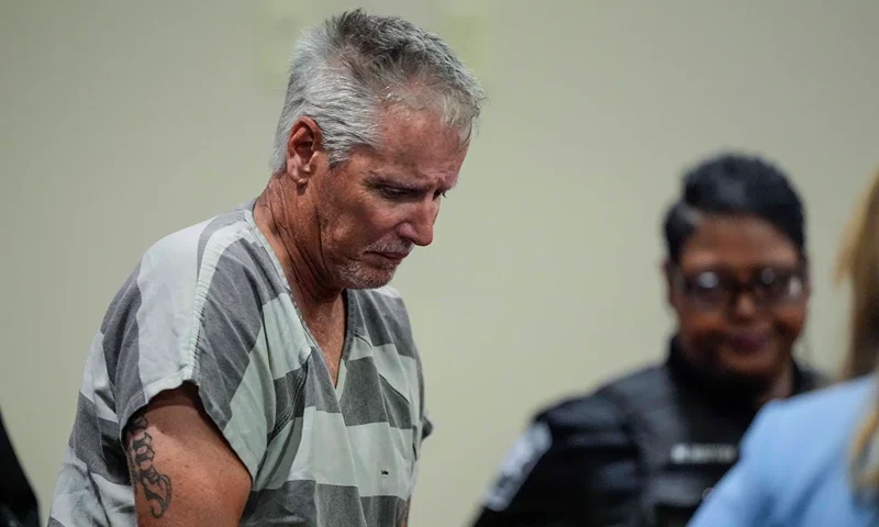 WINDER, GEORGIA - SEPTEMBER 6: Colin Gray, 54, the father of Apalachee High School shooting suspect Colt Gray, 14, enters the Barrow County courthouse for his first appearance, on September 6, 2024, in Winder, Georgia. Colin Gray is being charged with involuntary manslaughter, second-degree murder and cruelty to children after his son opened fire and killed 4 at the high school on Wednesday. (Photo by Brynn Anderson-Pool/Getty Images)