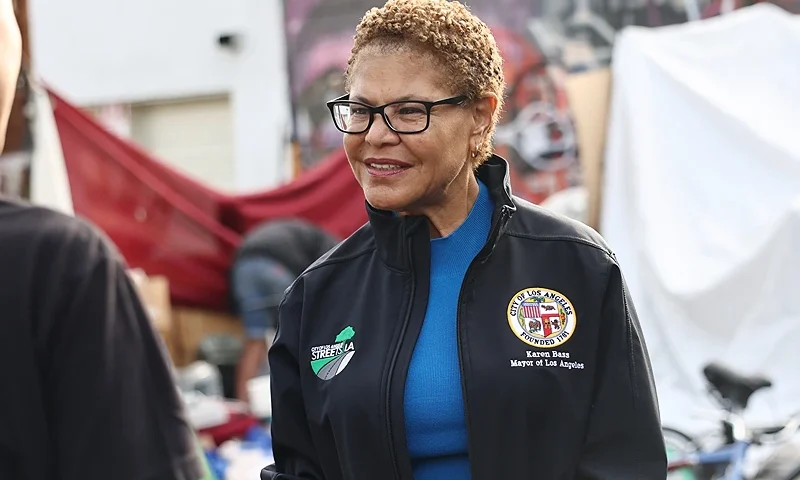 LOS ANGELES, CALIFORNIA - SEPTEMBER 26: Los Angeles Mayor Karen Bass stands at a homeless encampment during an Inside Safe operation on September 26, 2024 in Los Angeles, California. More than 25 were assisted into interim housing during the operation in the Filipinotown neighborhood. Mayor Bass' Inside Safe program has brought over 3,000 unhoused Los Angeles residents indoors and addressed over 60 homeless encampments. According to the 2024 Greater Los Angeles Homeless Count, street homelessness has decreased 10 percent in the city since last year. (Photo by Mario Tama/Getty Images)