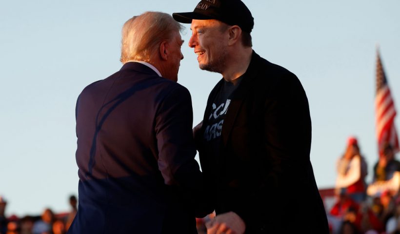 BUTLER, PENNSYLVANIA - OCTOBER 05: Elon Musk embraces Republican presidential nominee, former President Donald Trump during a campaign rally at the Butler Farm Show fairgrounds on October 05, 2024 in Butler, Pennsylvania. This is the first time that Trump has returned to Butler since he was injured during an attempted assassination on July 13. (Photo by Anna Moneymaker/Getty Images)