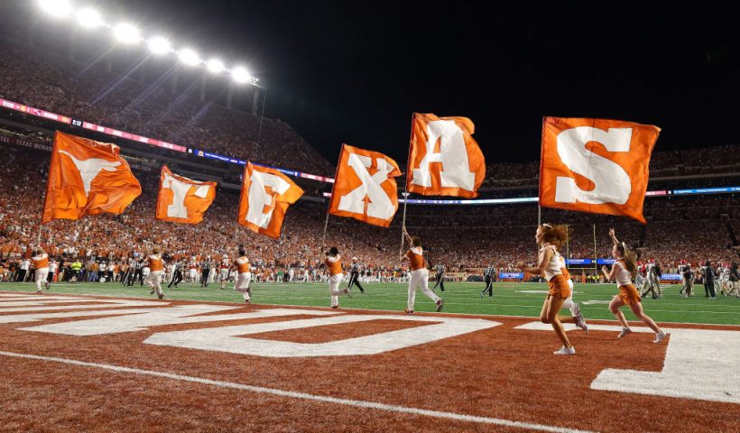 AUSTIN, TEXAS - OCTOBER 19: Texas Longhorns cheerleaders run with flags after a touchdown was scored during the third quarter against the Georgia Bulldogs at Darrell K Royal-Texas Memorial Stadium on October 19, 2024 in Austin, Texas. (Photo by Alex Slitz/Getty Images)