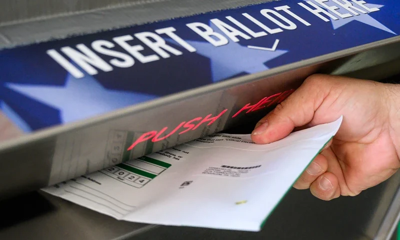 A voter uses a ballot drop box at the Bucks County Administration building voting on demand and ballot drop center in Doylestown, Pennsylvania on October 31, 2024. Kamala Harris clapped back Thursday at Donald Trump over what she called his "very offensive" remarks about women, returning reproductive rights to the fore as the rivals take their knife-edge White House race to western battleground states. (Photo by Ed JONES / AFP) (Photo by ED JONES/AFP via Getty Images)