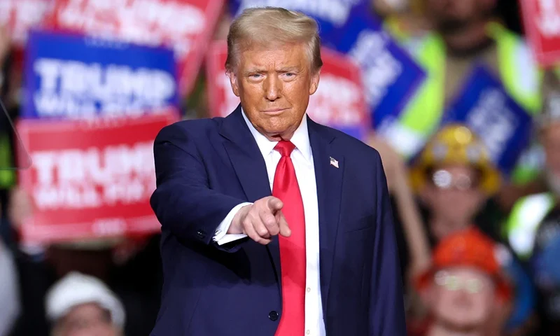 TOPSHOT - Former US President and Republican presidential candidate Donald Trump gestures during a campaign rally at PPG Paints Arena in Pittsburgh, Pennsylvania on November 4, 2024. (Photo by CHARLY TRIBALLEAU / AFP) (Photo by CHARLY TRIBALLEAU/AFP via Getty Images)