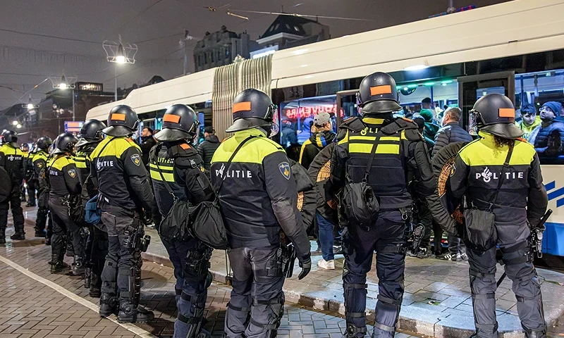 Dutch mobile Police officers stand guard after several scuffles broke out in the city center following the UEFA Europa League, League phase - Matchday 4, football match between Ajax Amsterdam and Maccabi Tel Aviv, in Amsterdam on November 8, 2024. Dutch Prime Minister Dick Schoof described "anti-Semitic attacks on Israelis" in Amsterdam as "unacceptable", in a message posted on his X account. (Photo by VLN Niews / ANP / AFP) / Netherlands OUT (Photo by VLN NIEWS/ANP/AFP via Getty Images)