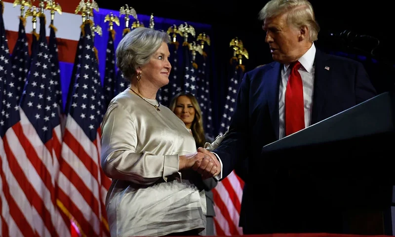 WEST PALM BEACH, FLORIDA - NOVEMBER 05: Republican presidential nominee, former U.S. President Donald Trump praises his campaign senior advisor Susie Wiles during an election night event at the Palm Beach Convention Center on November 06, 2024 in West Palm Beach, Florida. Americans cast their ballots today in the presidential race between Republican nominee former President Donald Trump and Vice President Kamala Harris, as well as multiple state elections that will determine the balance of power in Congress. (Photo by Chip Somodevilla/Getty Images)
