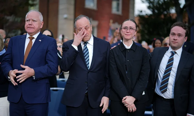 WASHINGTON, DC - NOVEMBER 06: (L-R) Democratic vice presidential nominee, Minnesota Gov. Tim Walz, Second gentleman Doug Emhoff, Ella Emhoff and Cole Emhoff react after Democratic presidential nominee, U.S. Vice President Kamala Harris conceded the election in a speech at Howard University on November 06, 2024 in Washington, DC. After a contentious campaign focused on key battleground states, the Republican presidential nominee, former U.S. President Donald Trump was projected to secure the majority of electoral votes, giving him a second term as U.S. President. Republicans also secured control of the Senate for the first time in four years. (Photo by Andrew Harnik/Getty Images)