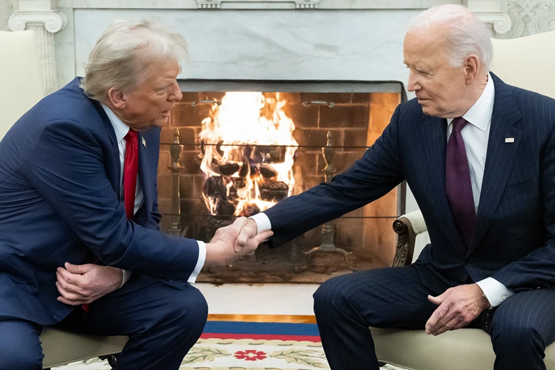 US President Joe Biden shakes hands with US President-elect Donald Trump during a meeting in the Oval Office of the White House in Washington, DC, on November 13, 2024. Trump thanked Biden for pledging a smooth transfer of power as the victorious Republican made a historic return visit to the White House on Wednesday. (Photo by SAUL LOEB / AFP) (Photo by SAUL LOEB/AFP via Getty Images)