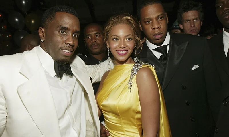 NEW YORK - JUNE 7 : Sean "P. Diddy" Combs and singers Beyonce Knowles and Jay-Z attend the Sean Jean/Zac Posen CFDA after-party at Marquee, on June 7, 2004 in New York City. (Photo by Evan Agostini/Getty Images)