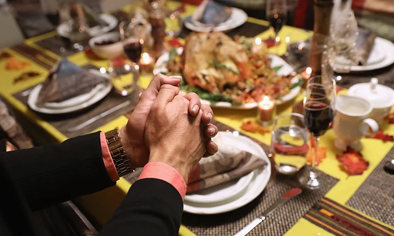 STAMFORD, CT - NOVEMBER 24: Central American immigrants and their families pray before Thanksgiving dinner on November 24, 2016 in Stamford, Connecticut. Family and friends, some of them U.S. citizens, others on work visas and some undocumented immigrants came together in an apartment to celebrate the American holiday with turkey and Latin American dishes. They expressed concern with the results of the U.S. Presidential election of president-elect Donald Trump, some saying their U.S.-born children fear the possibilty their parents will be deported after Trump's inauguration. (Photo by John Moore/Getty Images)