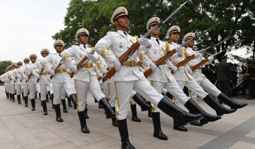TOPSHOT - Members of a Chinese military honour guard rehearse for a welcome ceremony for Uzbekistan President Shavkat Mirziyoyev outside the Great Hall of the People in Beijing on May 12, 2017. Mirziyoyev is on a state visit to China to attend the Belt and Road Forum for International Cooperation. (Photo by GREG BAKER / AFP) (Photo by GREG BAKER/AFP via Getty Images)