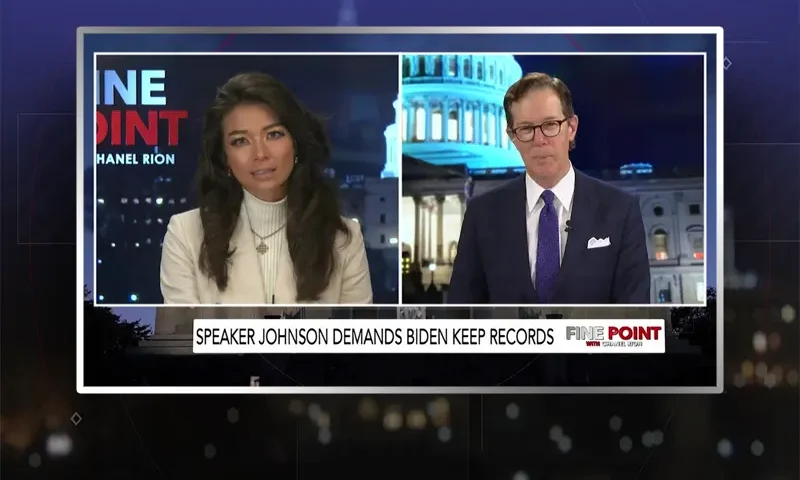 Video still from Fine Point on One America News Network showing a split screen of the host on the left side, and on the right side is the guest, John Hines.