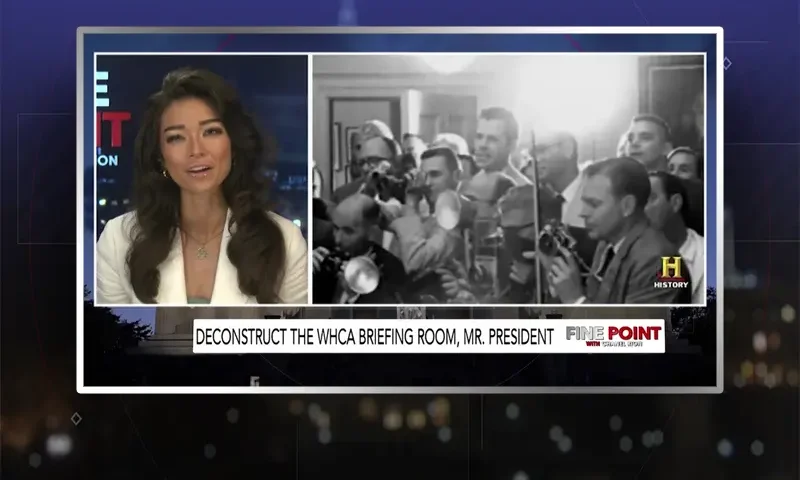 Video still of the host of Fine Point at the desk of their talk show on One America News Network.