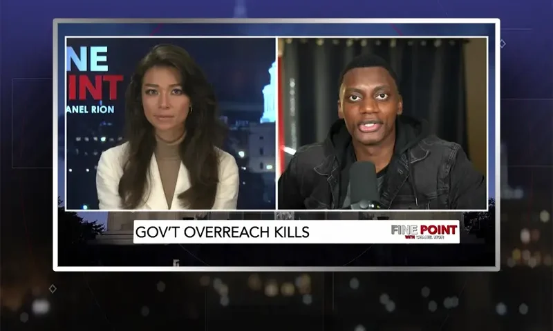 Video still from Fine Point on One America News Network showing a split screen of the host on the left side, and on the right side is the guest, George Behizy.