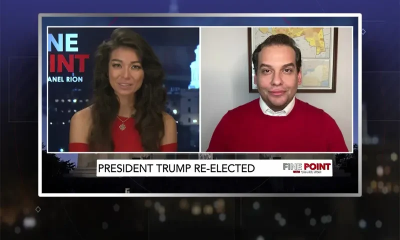 Video still from Fine Point on One America News Network showing a split screen of the host on the left side, and on the right side is the guest, George Santos.