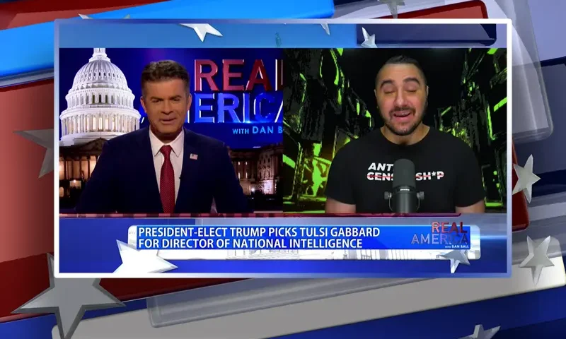 Video still from Real America on One America News Network showing a split screen of the host on the left side, and on the right side is the guest, Drew Hernandez.