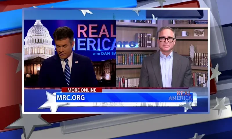 Video still from Real America on One America News Network showing a split screen of the host on the left side, and on the right side is the guest, Dan Schneider.