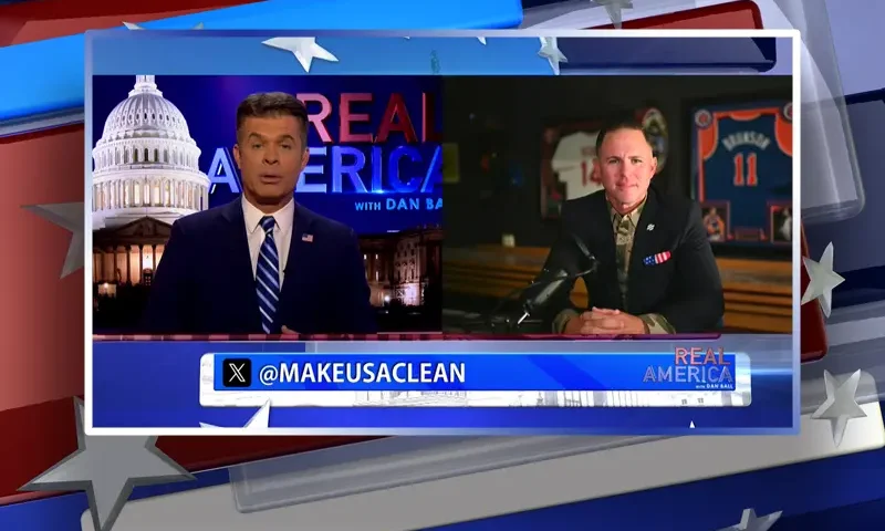 Video still from Real America on One America News Network showing a split screen of the host on the left side, and on the right side is the guest, John Rourke.