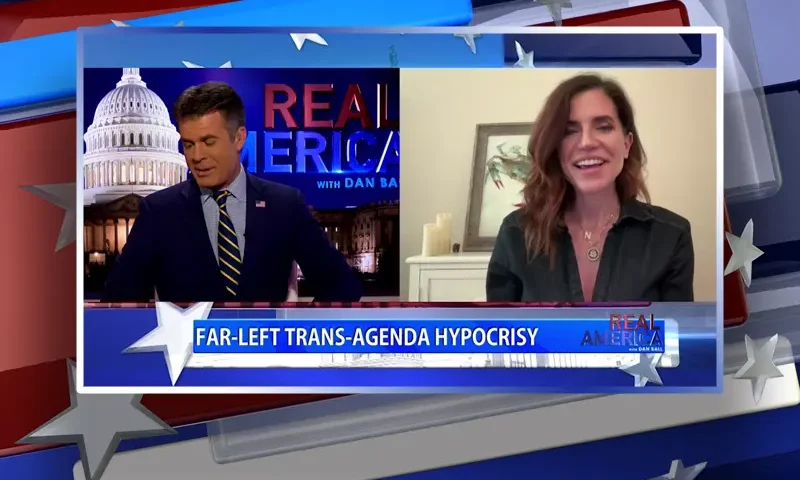 Video still from Real America on One America News Network showing a split screen of the host on the left side, and on the right side is the guest, Rep. Nancy Mace.